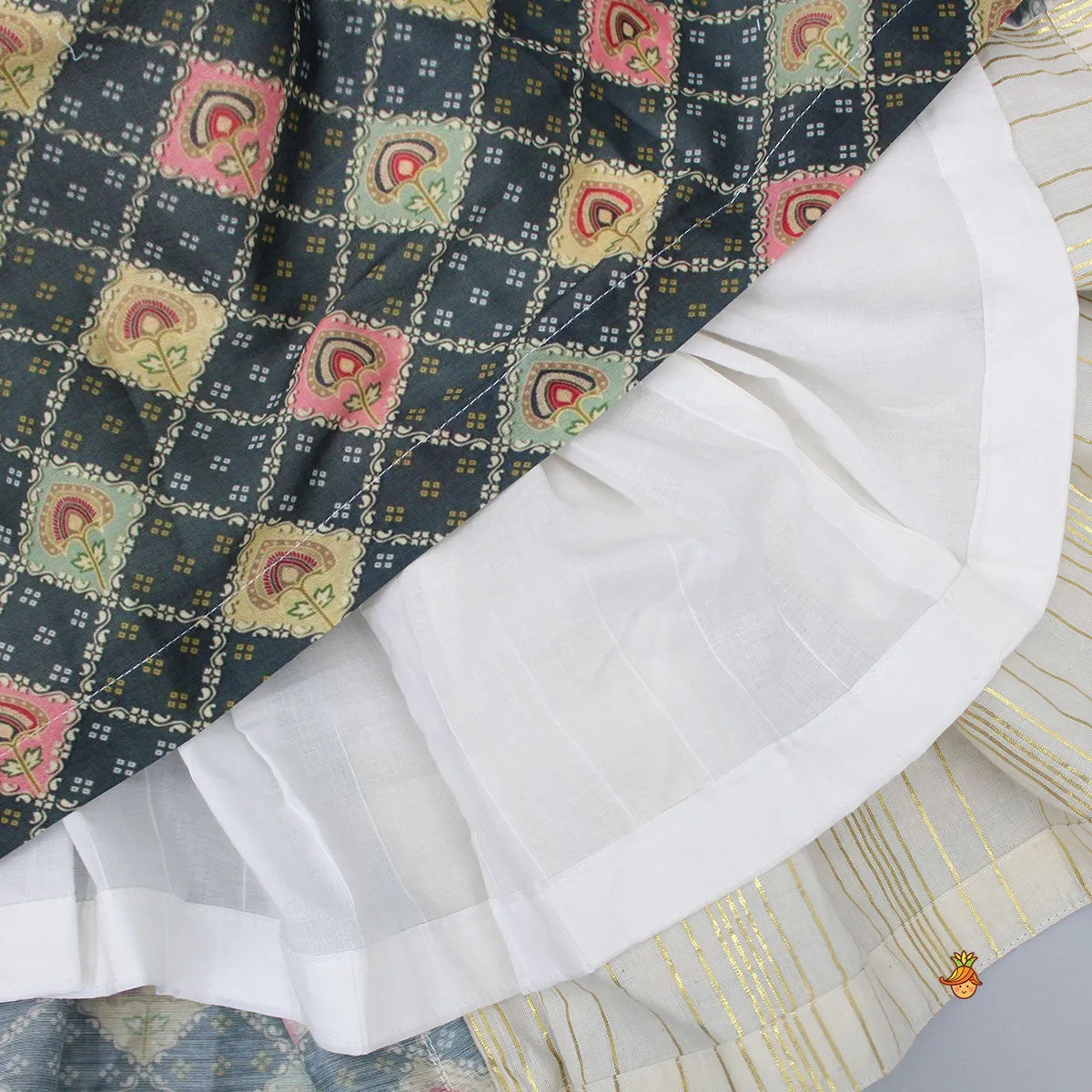 Pre Order: V Neck Lurex Striped Lace Work Ivory Top And Tassels Enhanced Lehenga With Matching Dupatta