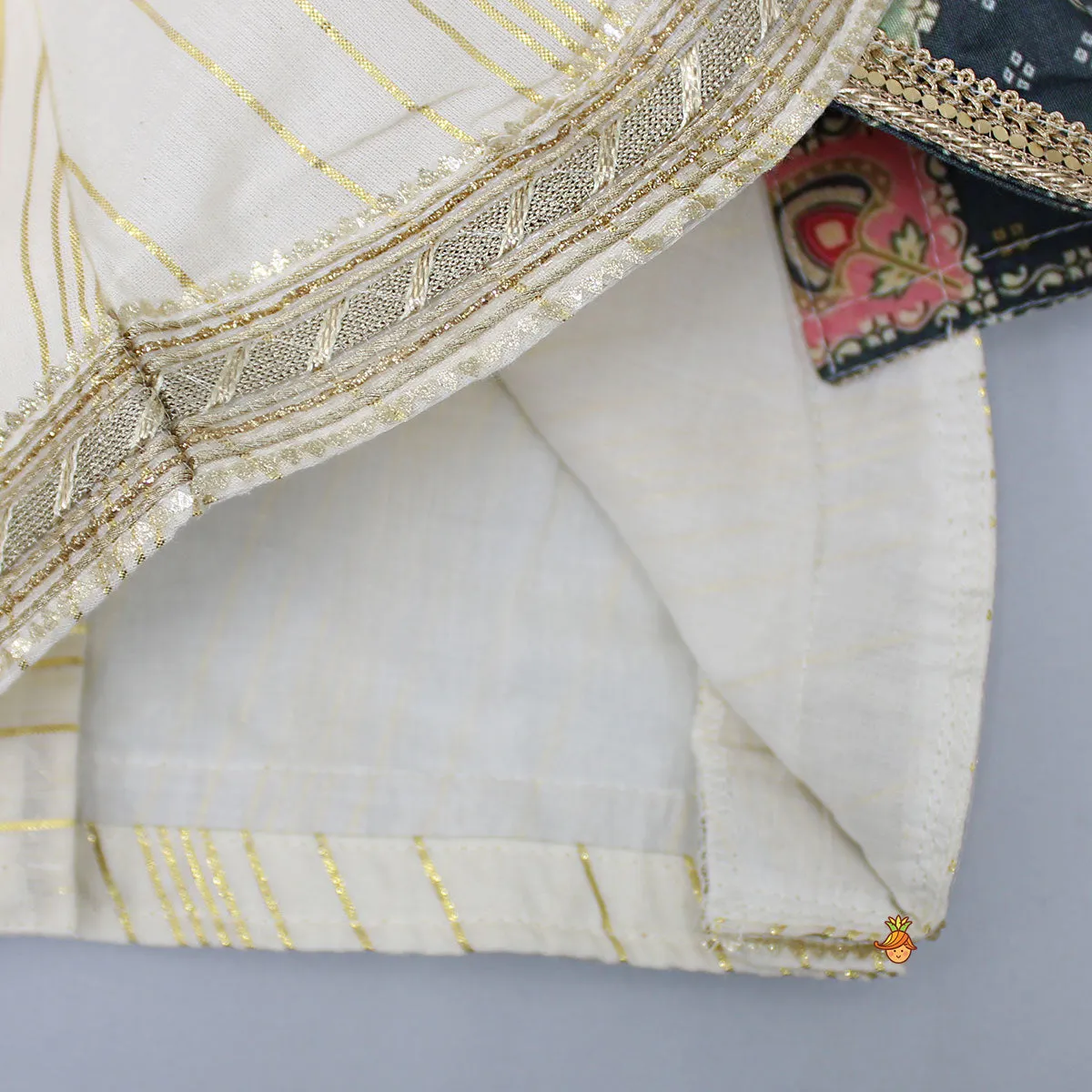 Pre Order: V Neck Lurex Striped Lace Work Ivory Top And Tassels Enhanced Lehenga With Matching Dupatta